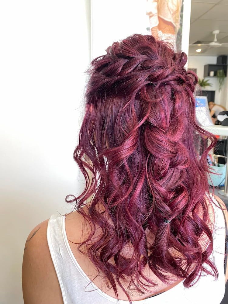 A Woman With Red Hair is Wearing a White Tank Top — Coolum Cutting Edge in Peregian Springs, QLD