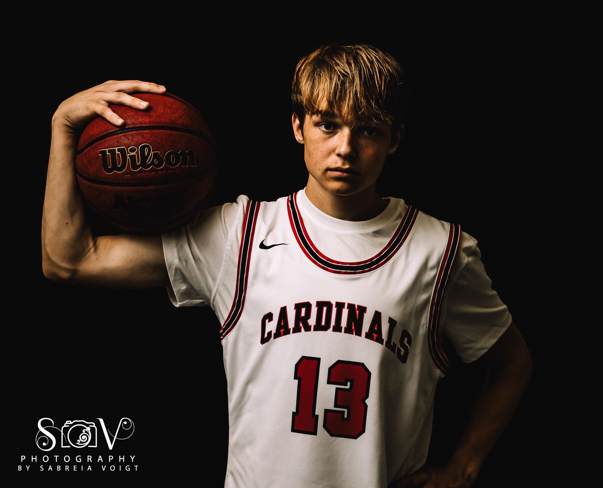 Basketball player in white jersey with 