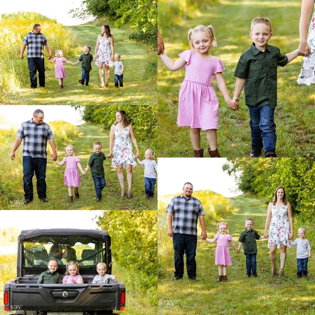 Family outdoors, walking and holding hands. Mom in floral dress, dad in plaid shirt. Two children in pink and green.