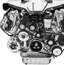 Chrome engine with belts and pulleys, angled view. | Strong's Alignment Service