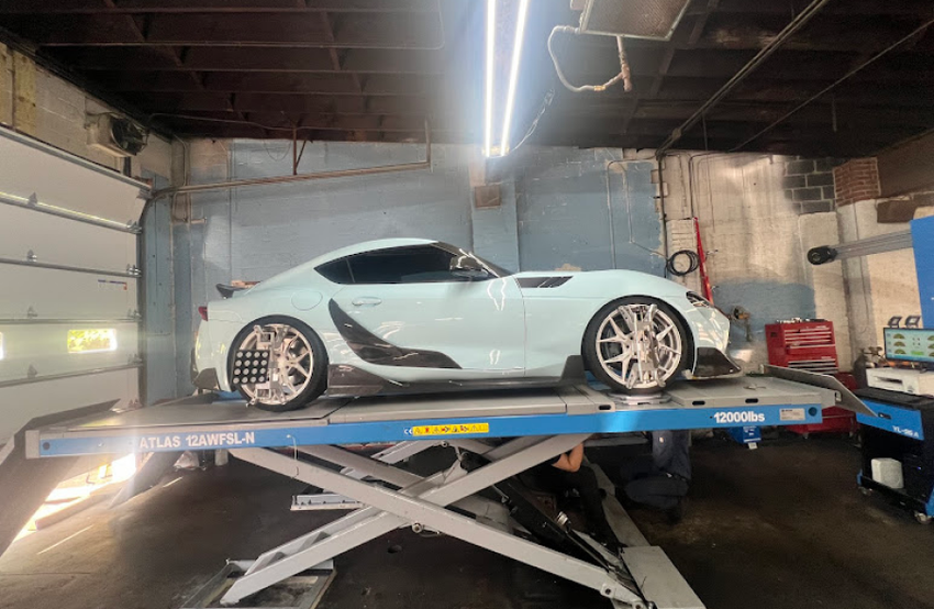 auto repair team standing in garage | Oscar's Automotive