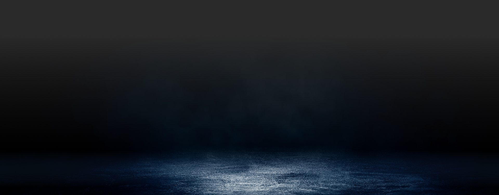 Dark, moody background with a blue-lit, wet-looking floor. | Strong's Alignment Service