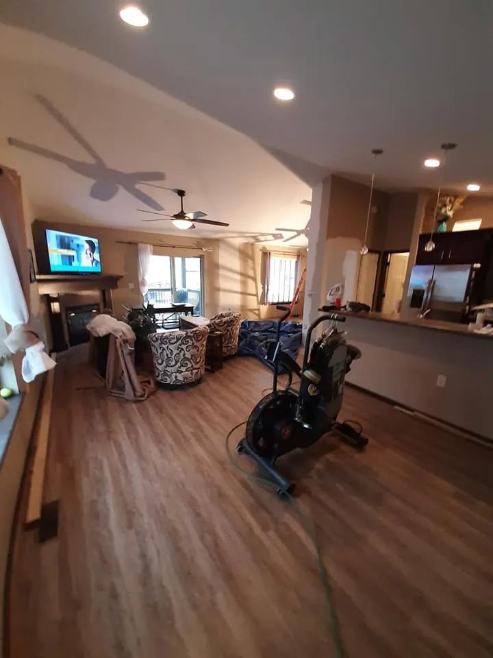 There is a bicycle in the middle of the living room.