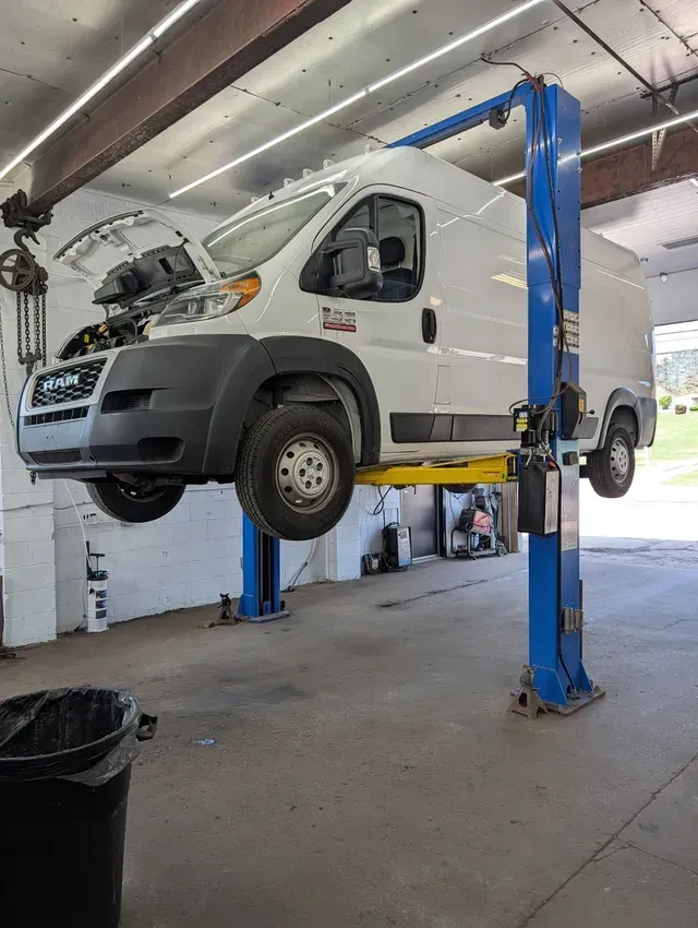 Commercial Van Lifted For Auto Service | Treadlogic
