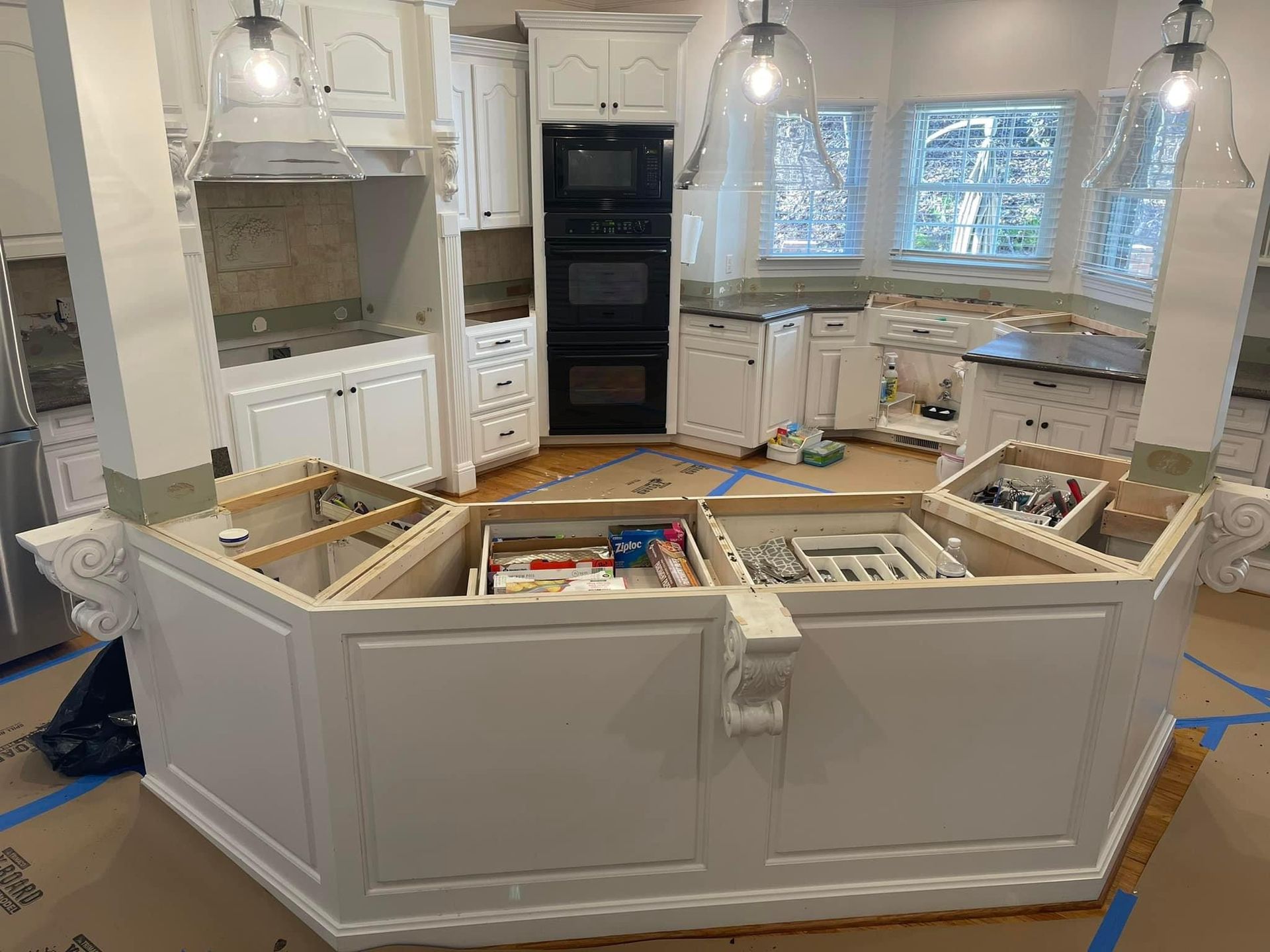 kitchen renovation with gorgeous tile backsplash waiting for granite countertops