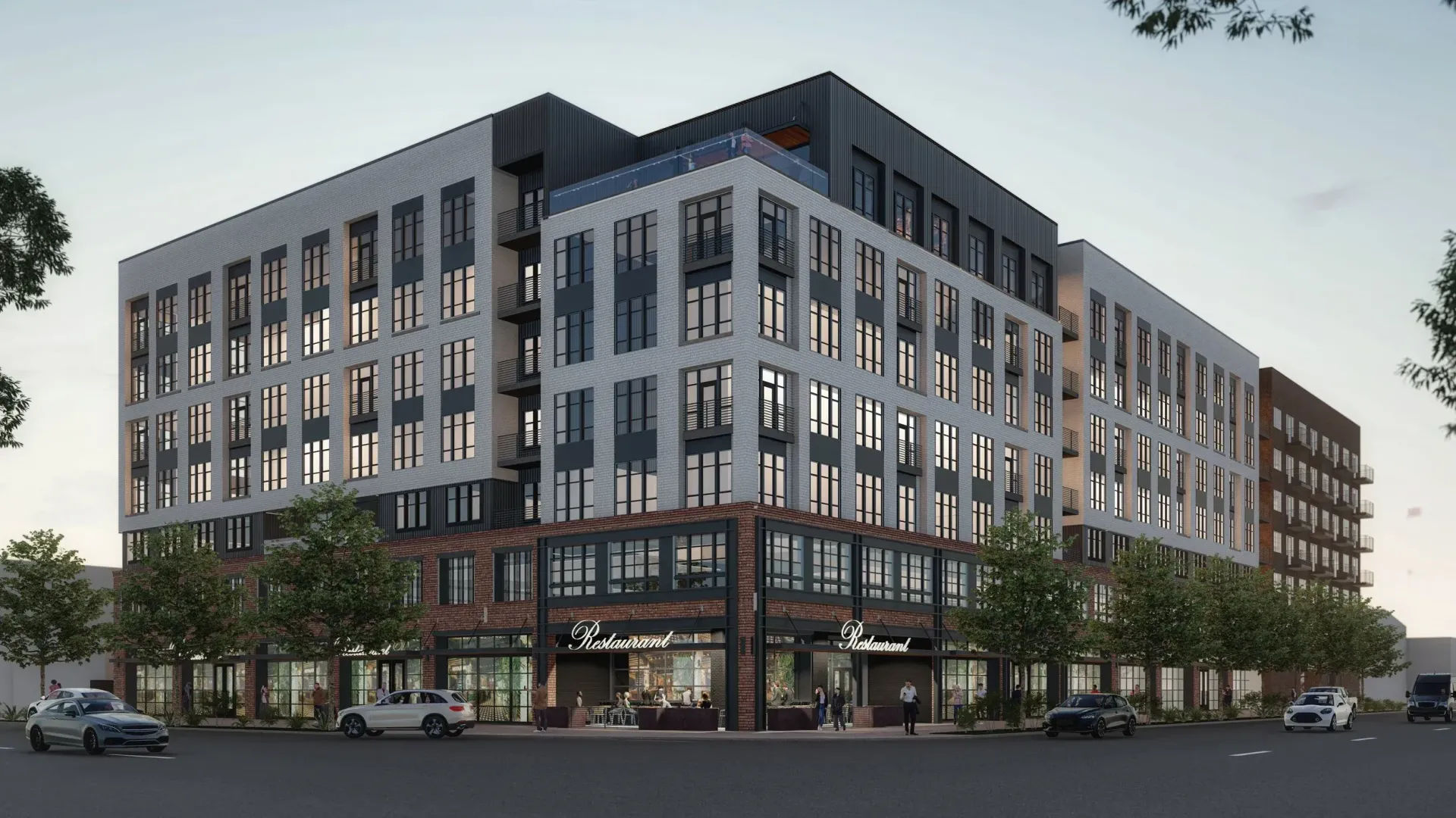 Modern multi-story apartment building with retail on the ground floor. Exterior shot on a sunny day.