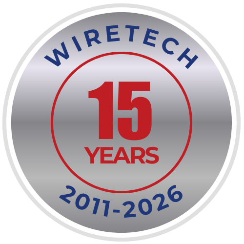 Wiretech 15th Anniversary logo. Silver badge with blue text, red circle, and numbers 15 and years. 2011-2026.