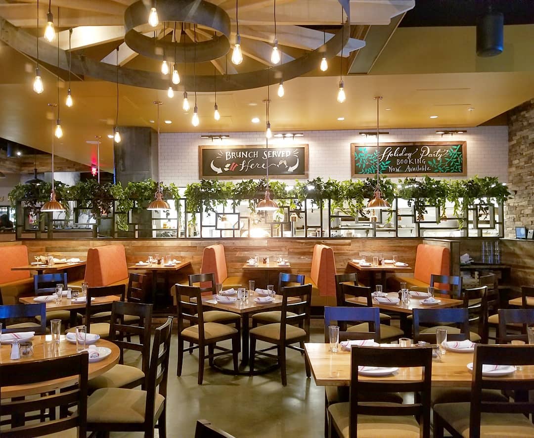 a restaurant with a lot of tables and chairs