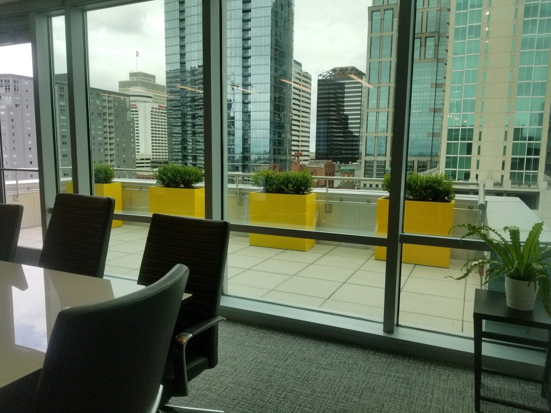 a conference room with a view of a city skyline