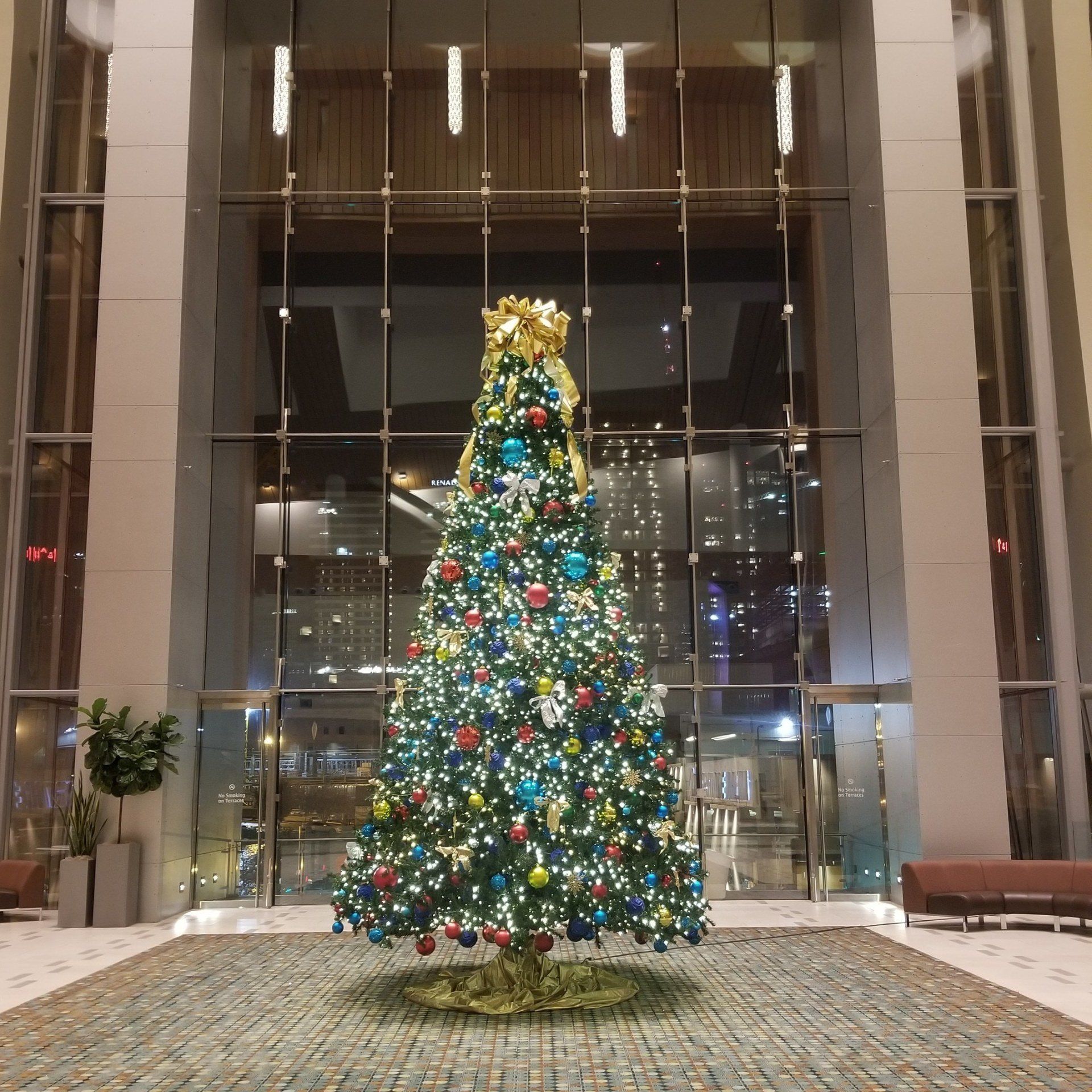 a large christmas tree in the middle of a building