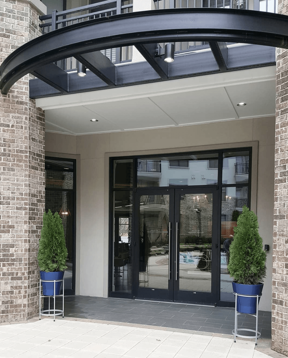 the entrance to a building with a canopy over it