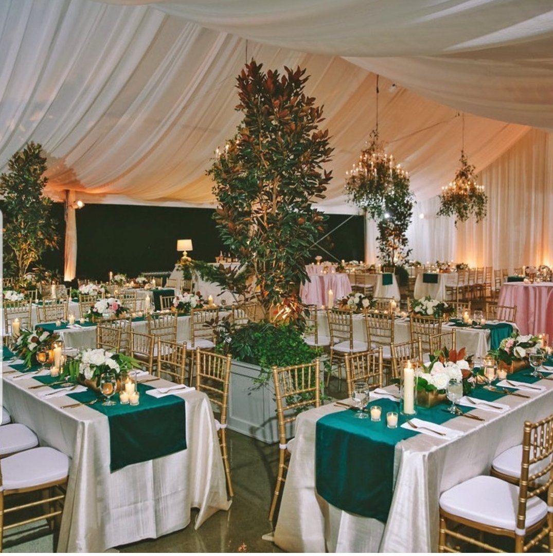 a large room with tables and chairs set up for a wedding reception