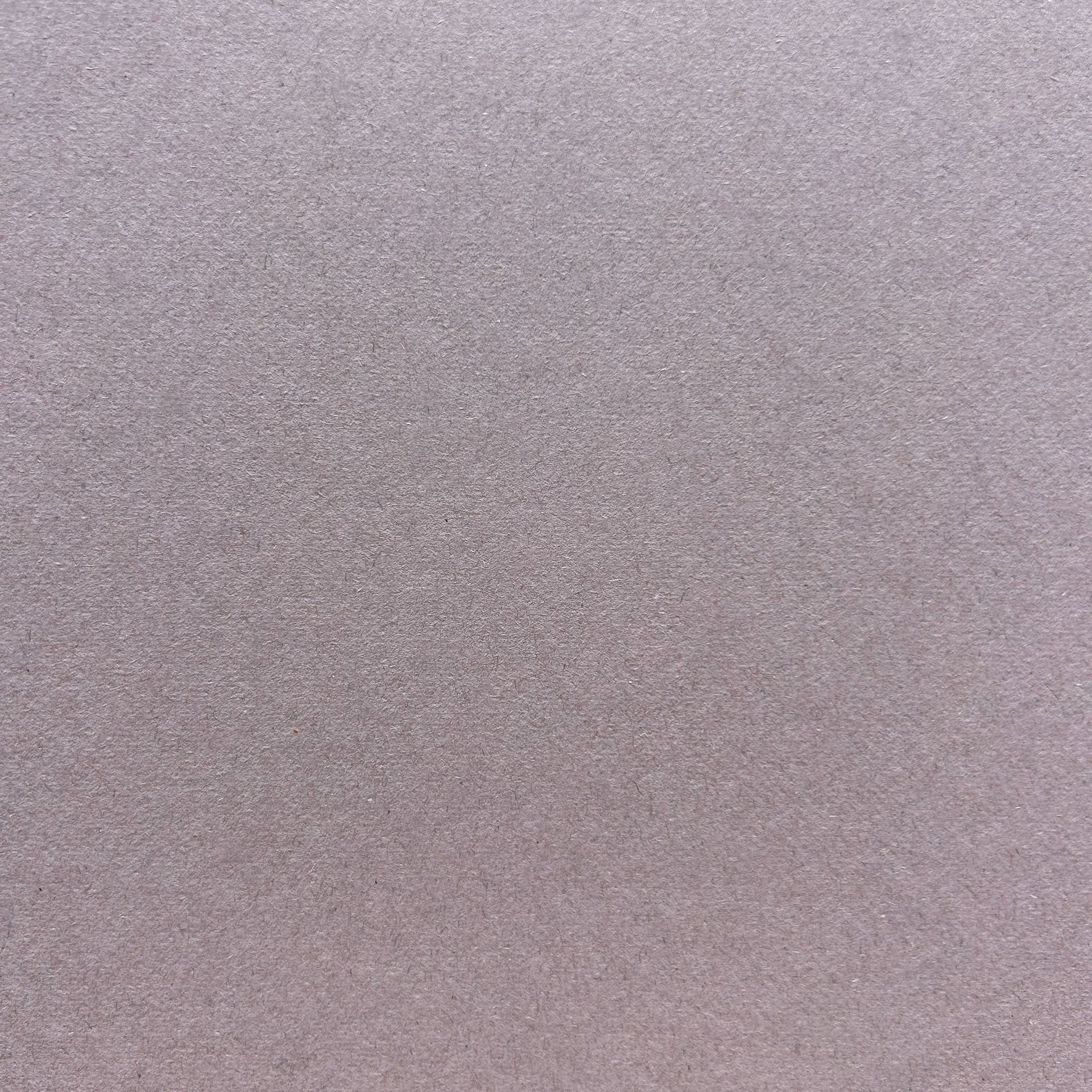 Un gros plan d'une texture de tapis violet.