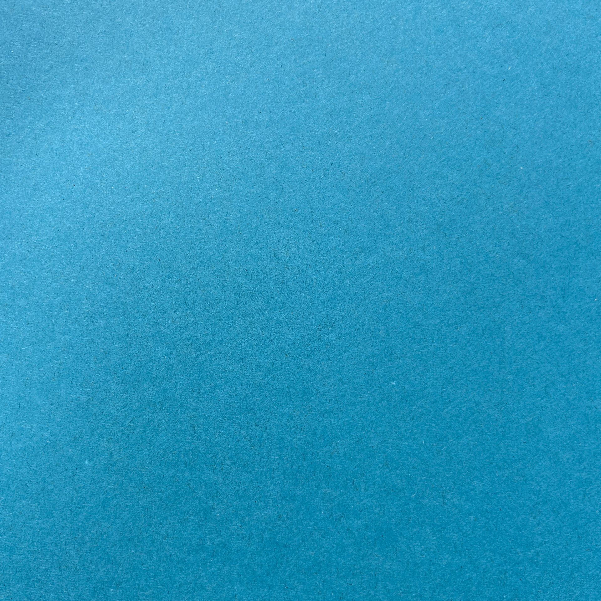 Un gros plan d'une texture de tapis bleu.