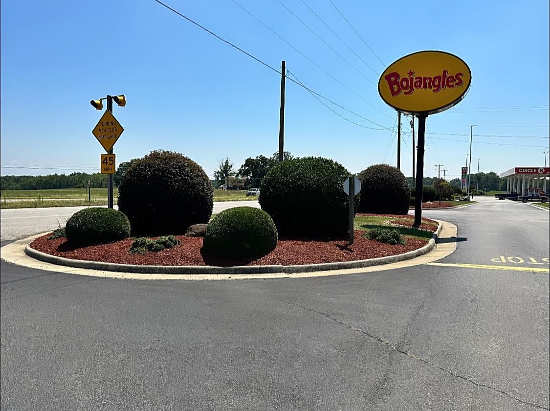 A roundabout with a sign that says bojangles on it