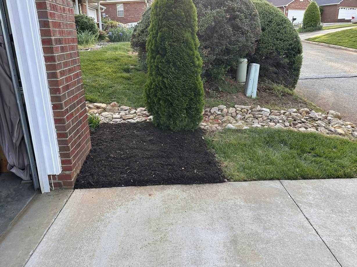 There is a brick building in the background and a sidewalk in the foreground.