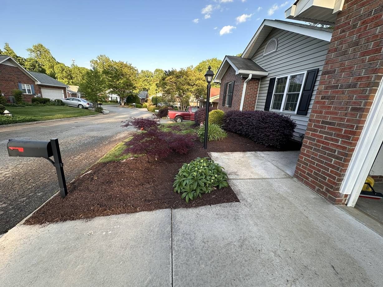 A brick house with a mailbox in front of it.