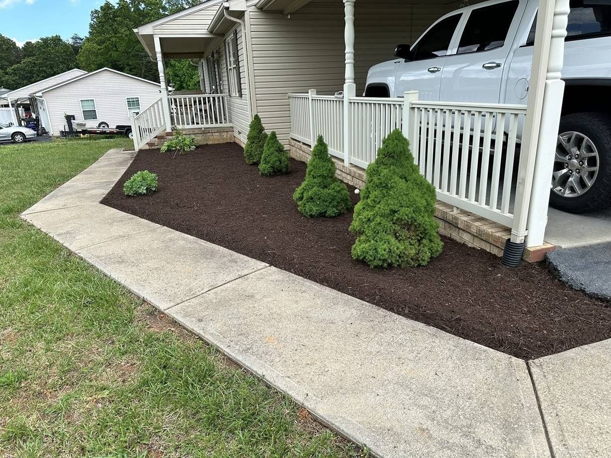 A white truck is parked in front of a house.