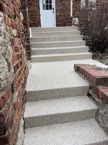 A set of stairs leading up to a brick building.