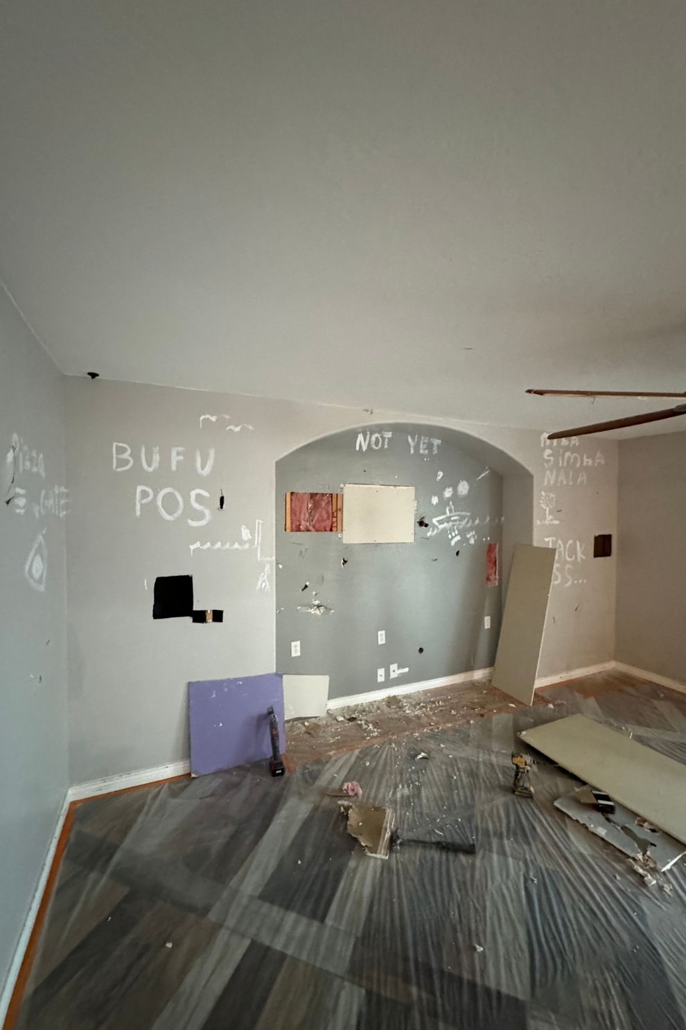 A room with a lot of pieces of wood on the floor and walls.