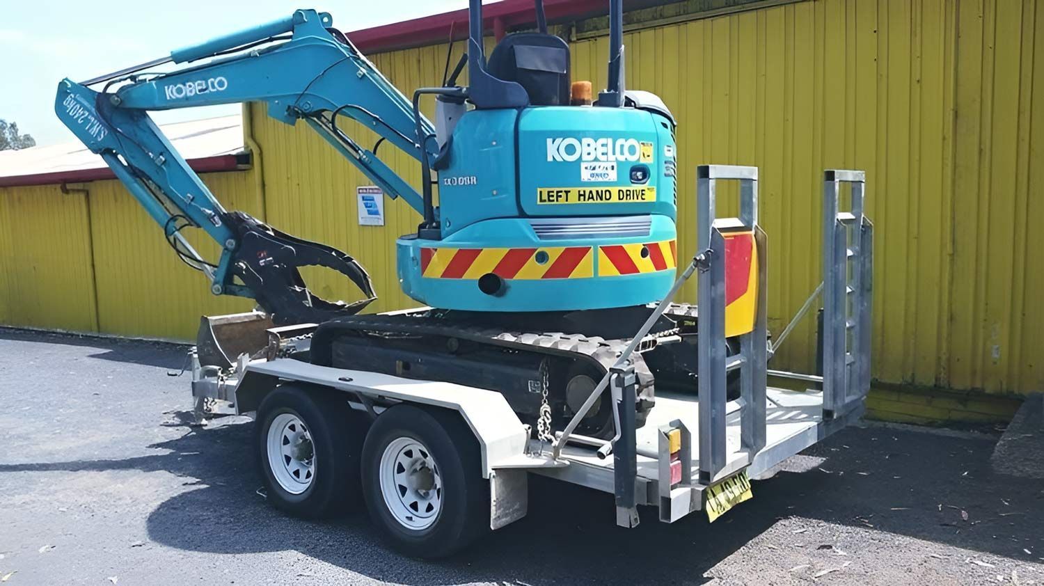 Bobcat Trailer With Excavator — Hastings Trailer Centre in Port Macquarie, NSW