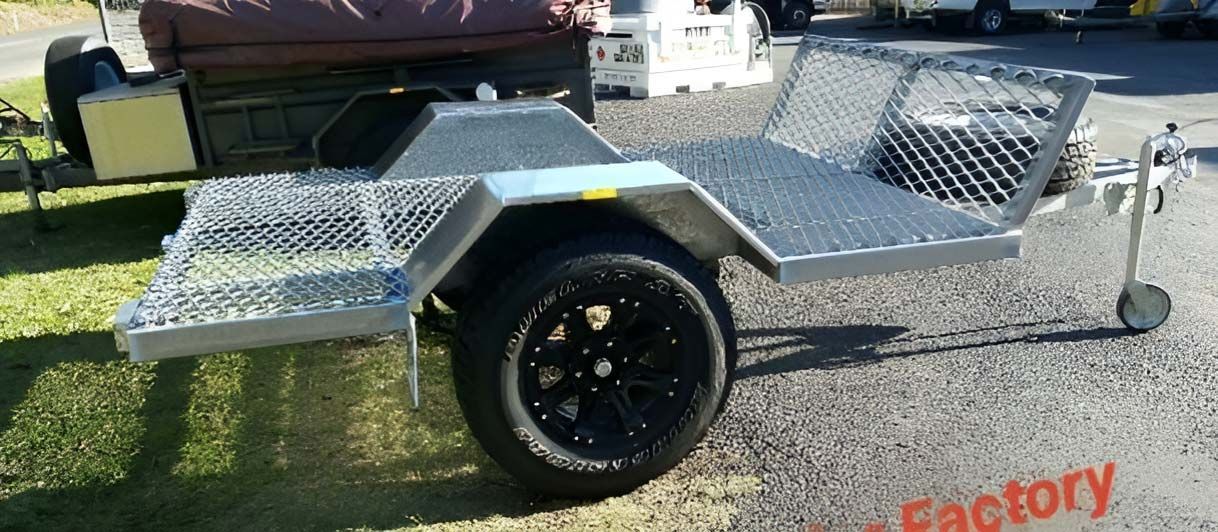 A Small Trailer Is Parked On The Side Of The Road — Hastings Trailer Centre in Port Macquarie, NSW