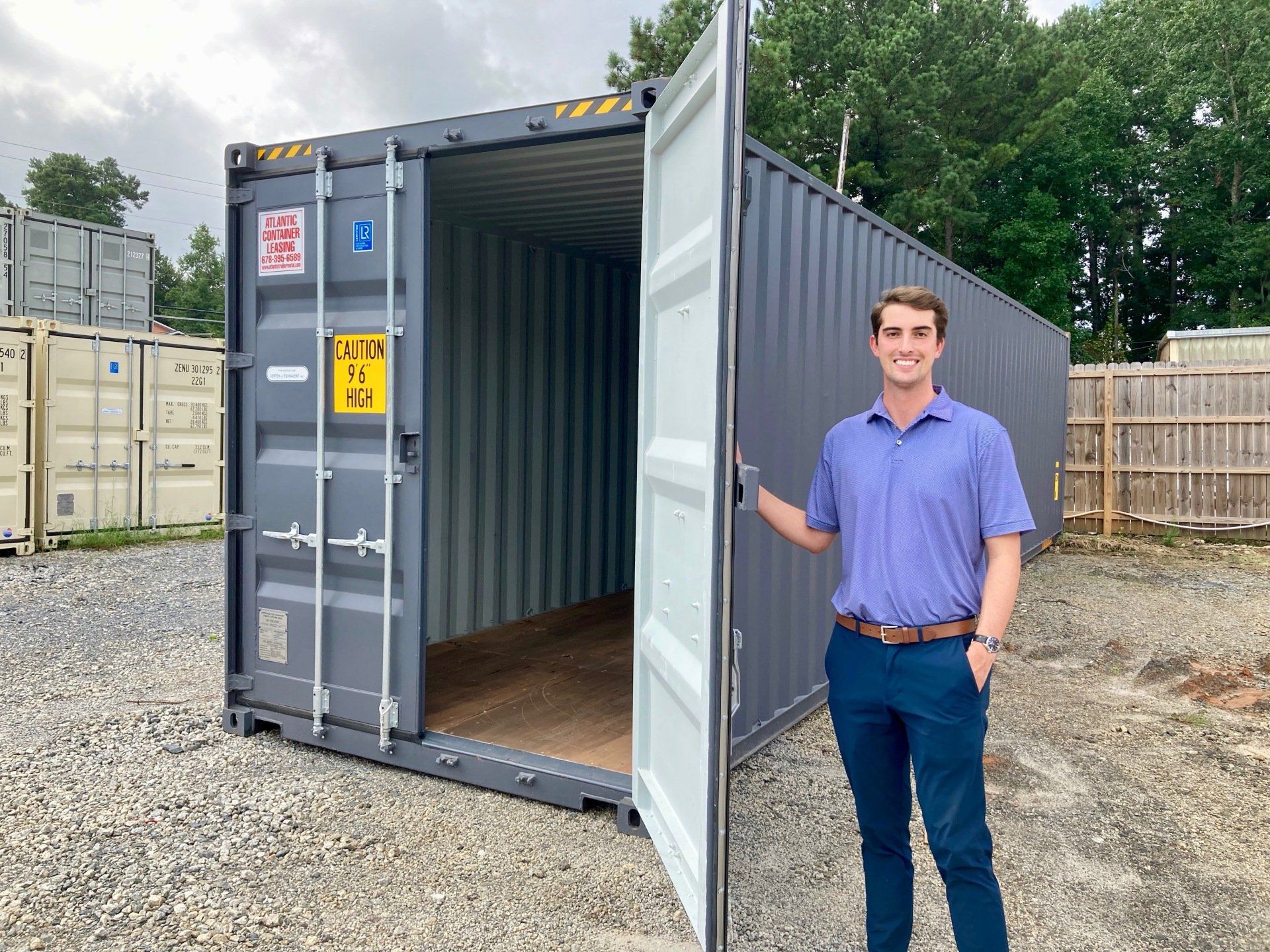 man standing in storage container