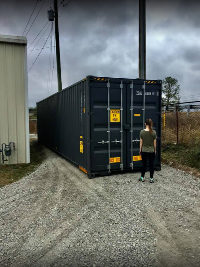 woman inspecting the shipping container