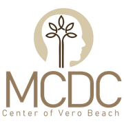 a logo for the mcdc center of vero beach