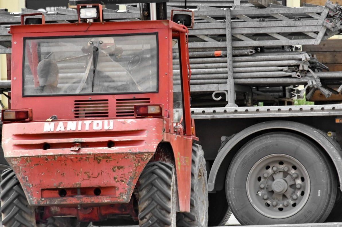 tractor towing heavy equipment