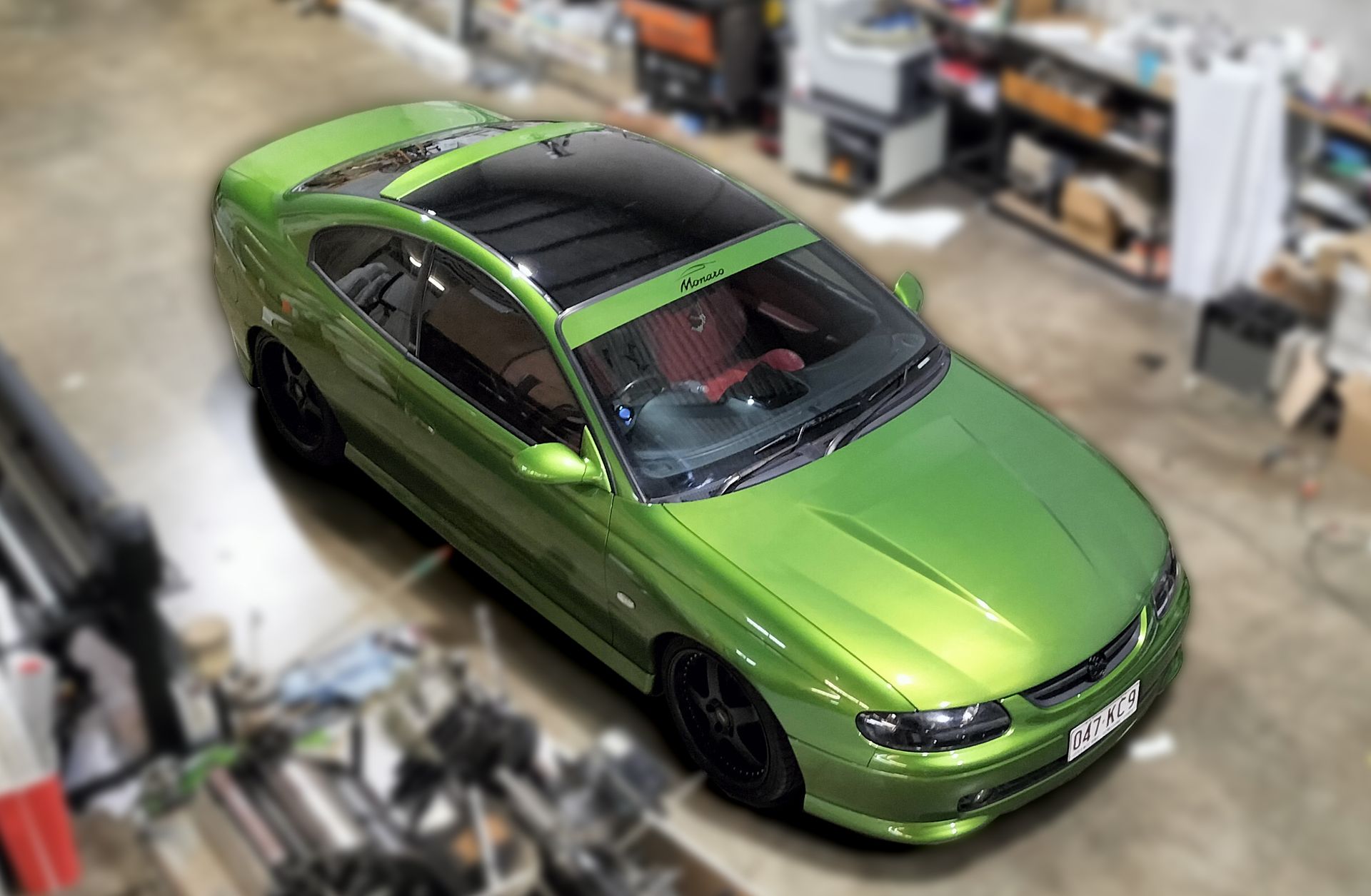 A Boat With a Shark on the Side is on a Trailer — Caledonian Colour In Kunda Park, QLD