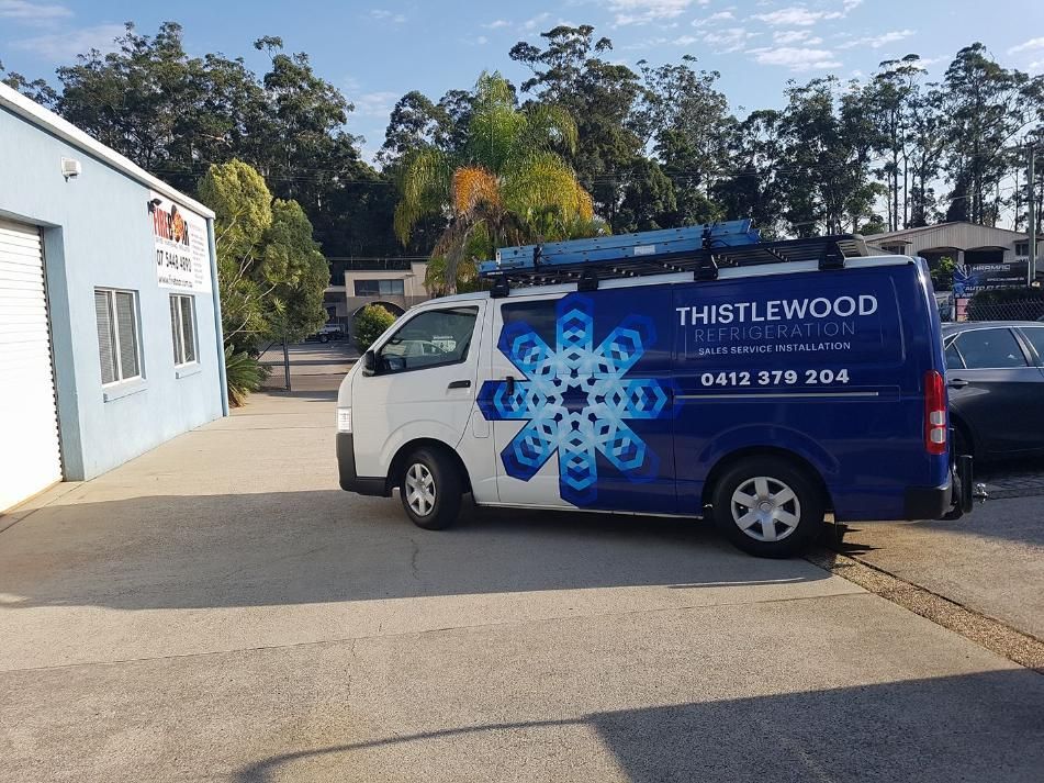 A Blue and White Van is Parked in Front of a Building — Caledonian Colour In Kunda Park, QLD
