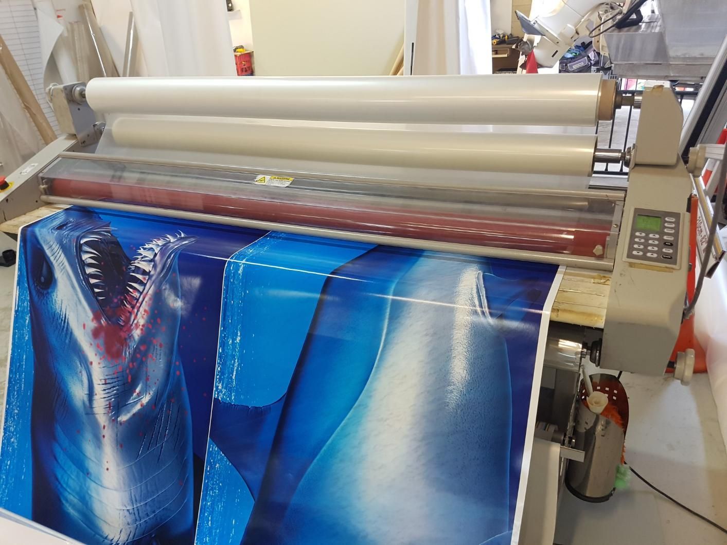 A Boat With a Shark on the Side is on a Trailer — Caledonian Colour In Kunda Park, QLD