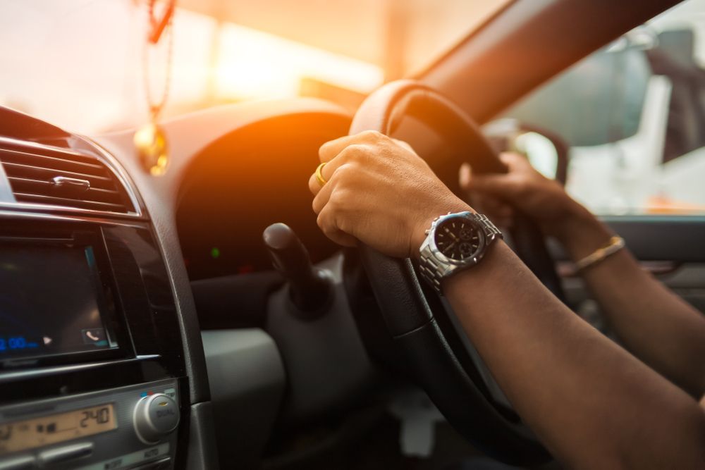 Hands Gripping a Steering Wheel Inside a Car — Jims Auto Care in Berrimah, NT