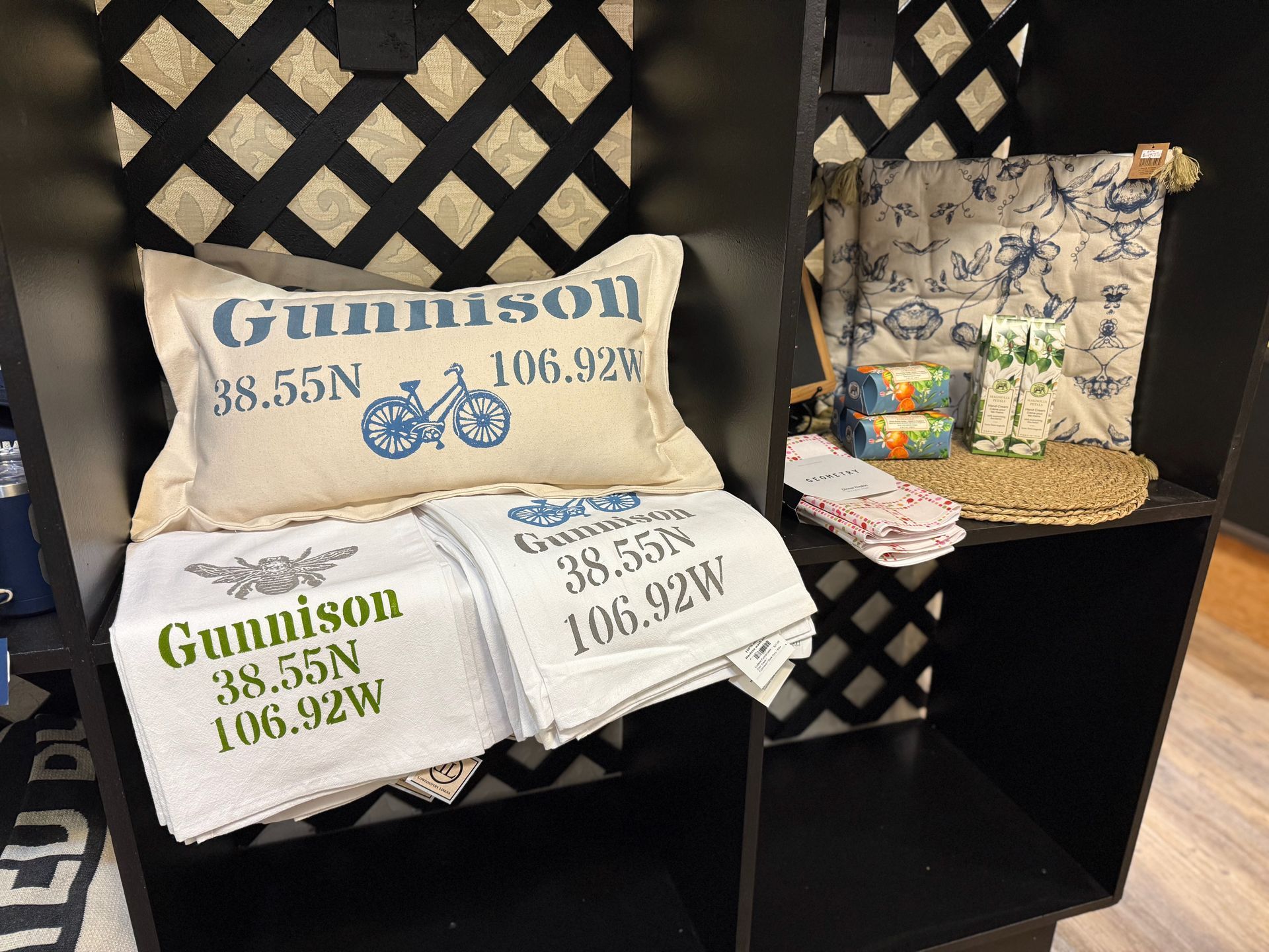 A shelf with a pillow that says gunnson on it
