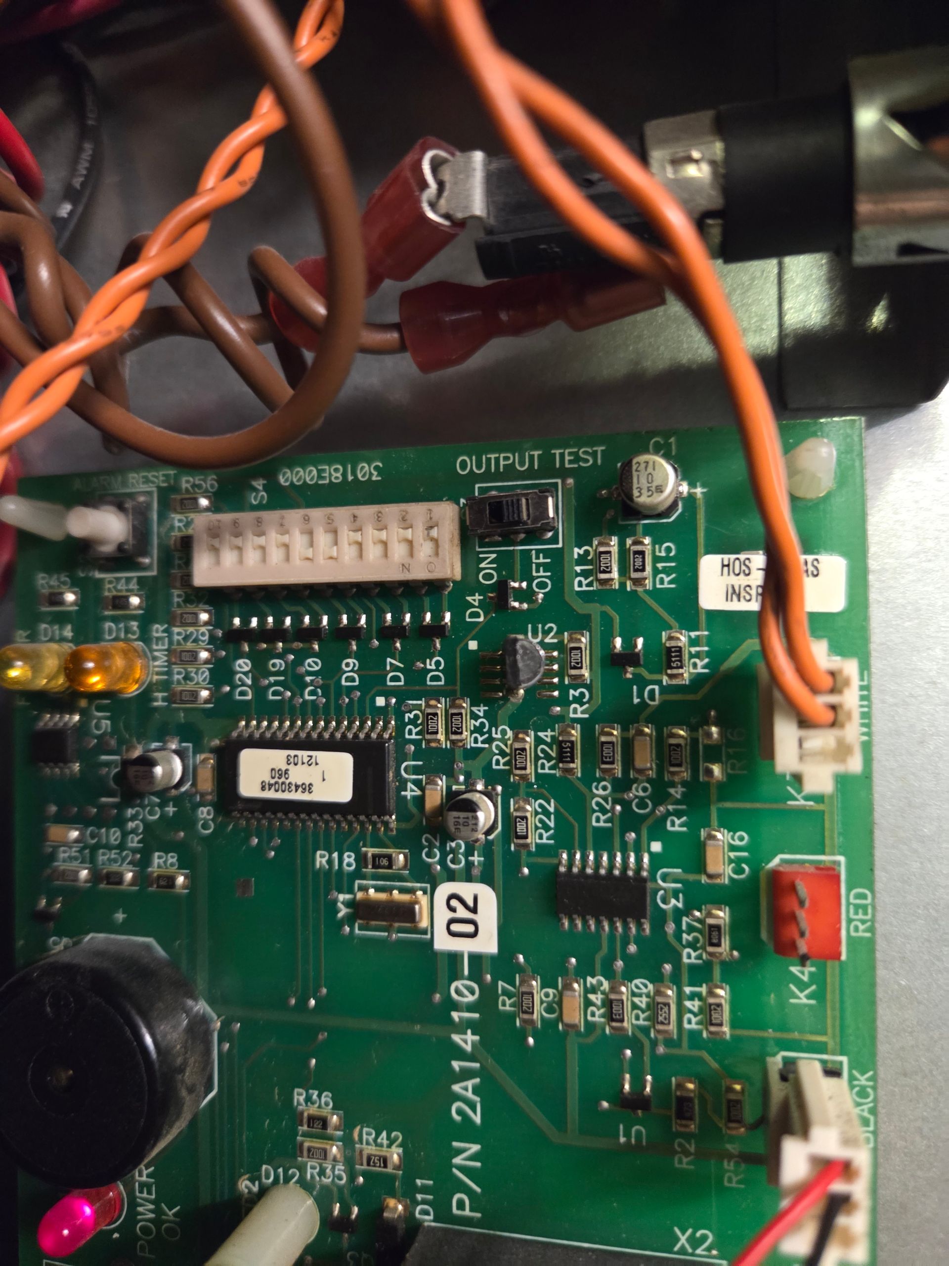 Green circuit board with wiring and electronic components labeled P/N 2A1410-02.