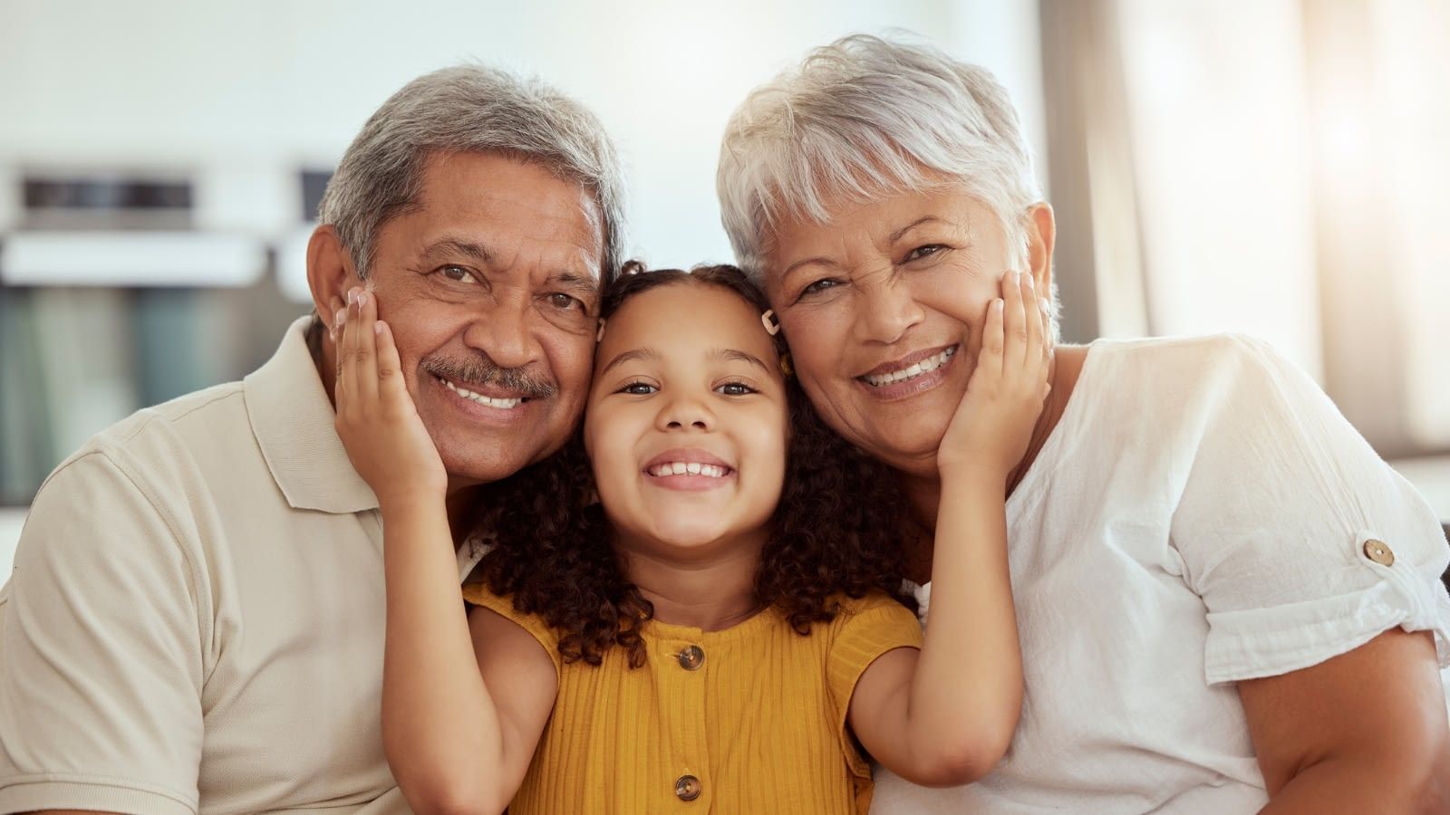 celebrating latino history month latina granddaughter hugging grandparents