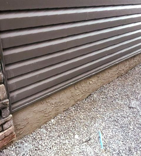 A close up of a siding on the side of a house.