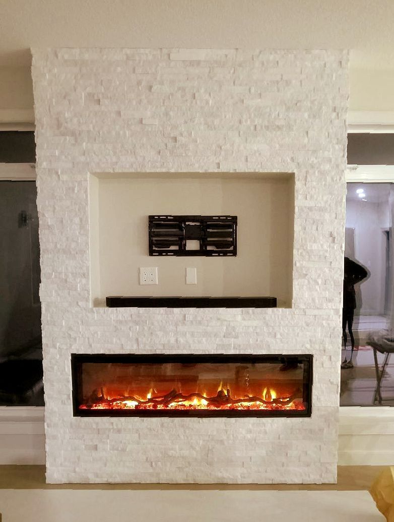 There is a fireplace in the middle of the wall in the living room.