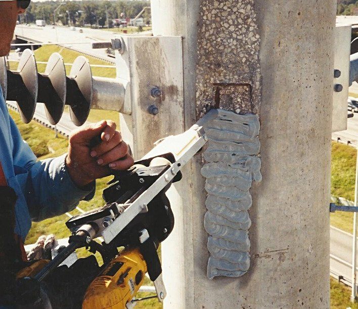 Application of Concrete Pole Repair (CPR) to a damaged utility structure