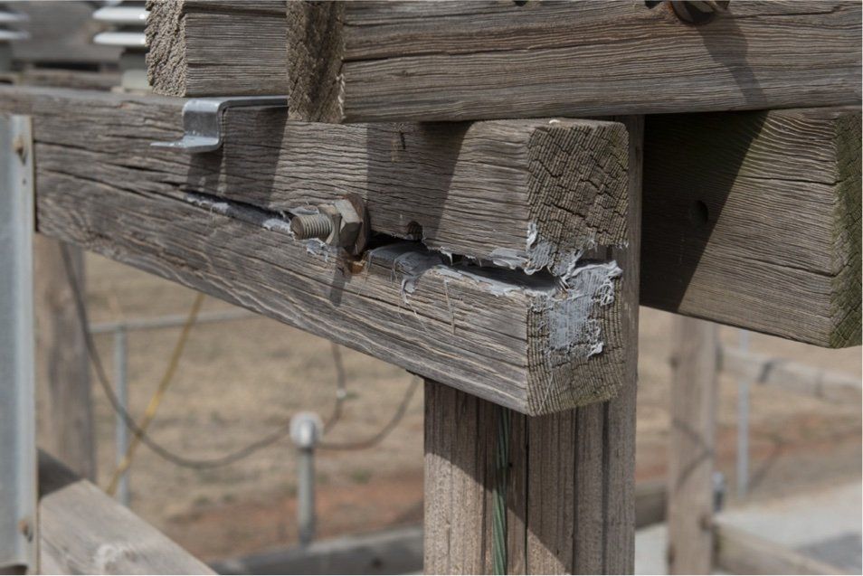 Two men mixing Secure Set components with buckets and power stirring tool