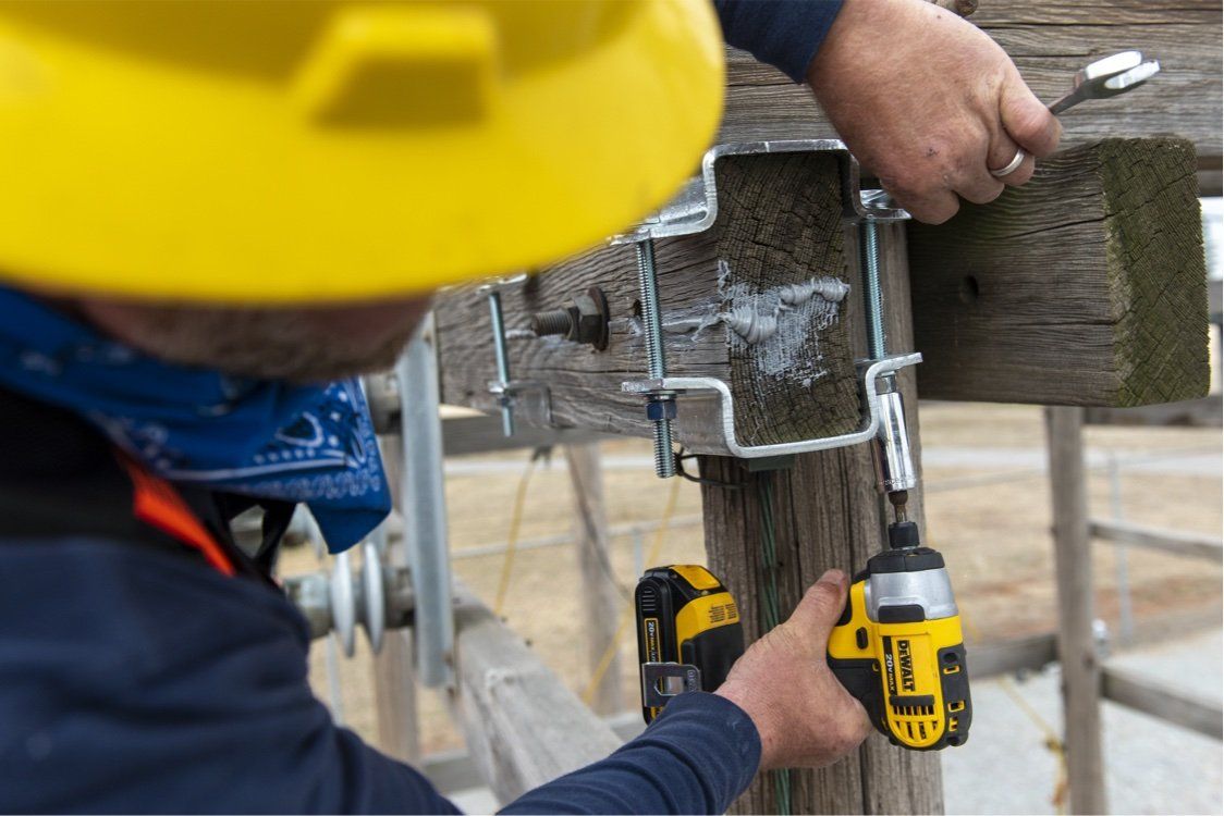 Secure Set being poured into a hole to set a utility pole