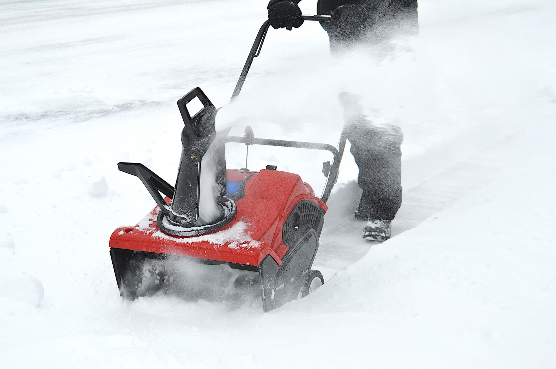 Man Using Snow Blower After A Snowstorm — Cookeville, TN — Putnam County Tree Service