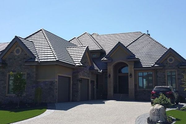 A large house with a car parked in front of it