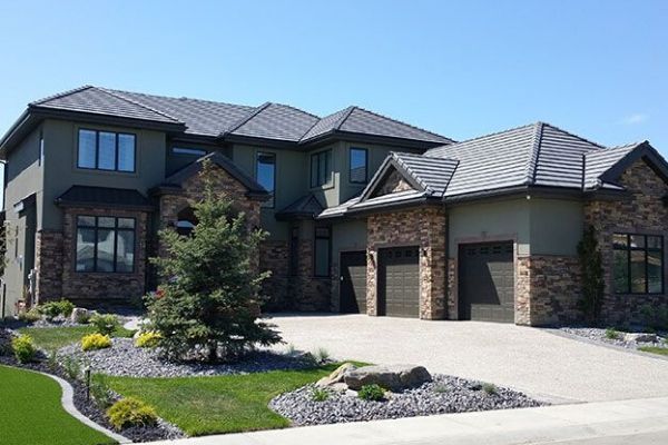 A large house with two garages and a driveway