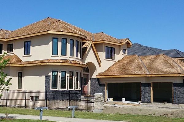 A large house with a fence in front of it
