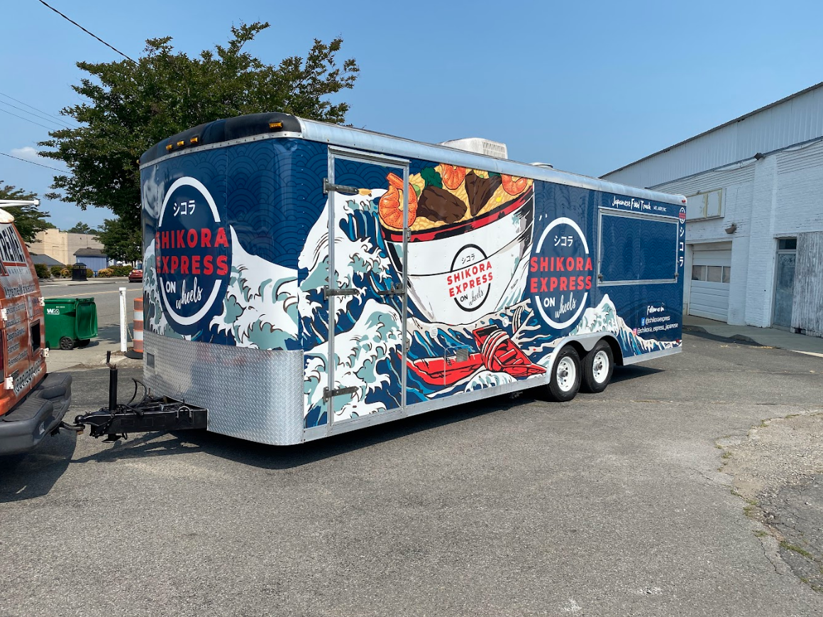 Food truck wrap for hibachi restaurant. Wrap is blue with waves and giant ramen bowl.