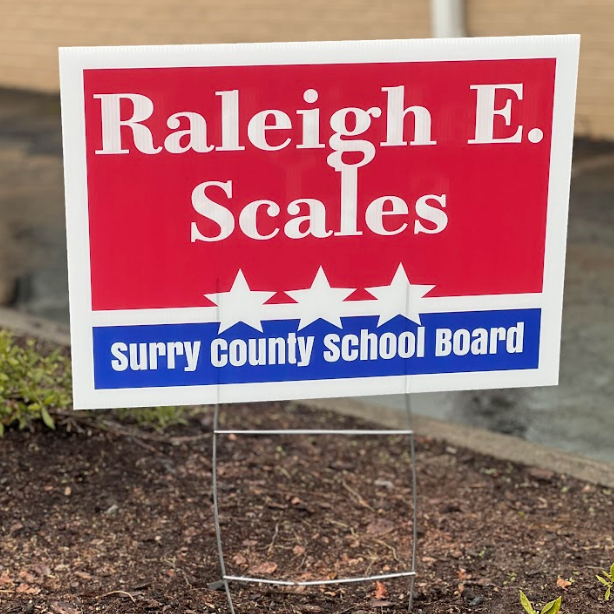 Sign for tattoo shop suspended from ceiling