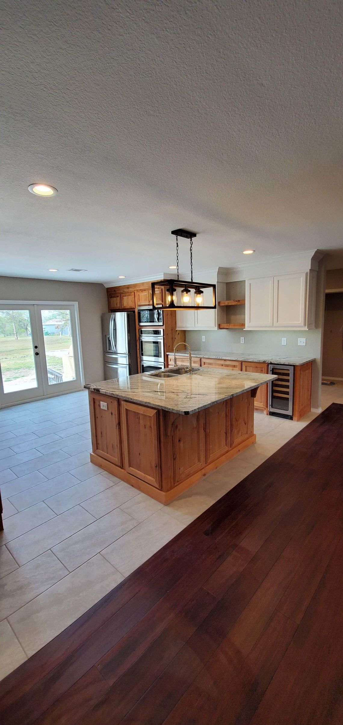 There is a large island in the middle of the kitchen.