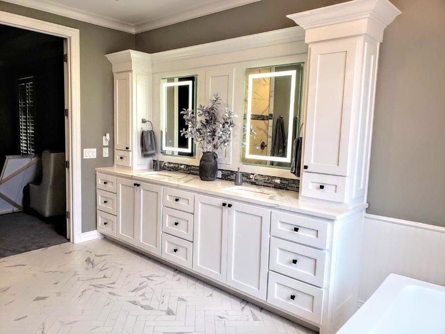 A bathroom with two sinks and two mirrors.